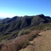 Looking eastward from the ridge, back at the Gridley Trail I had climbed, and seeing the ocean beyond the valley.