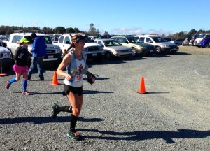 Running through the first aid station around Mile 8 (thanks to Christy Bentivoglio for the photo).