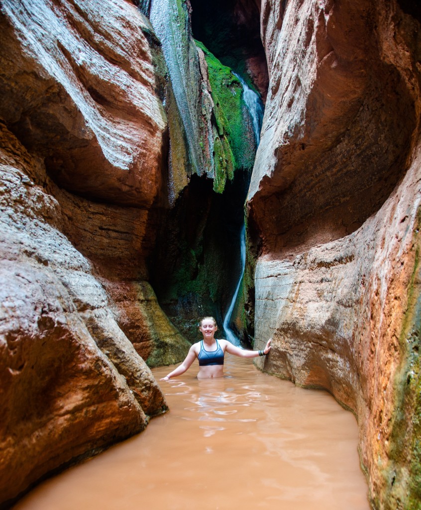 Colly in a side canyon waterfall during a day hike.