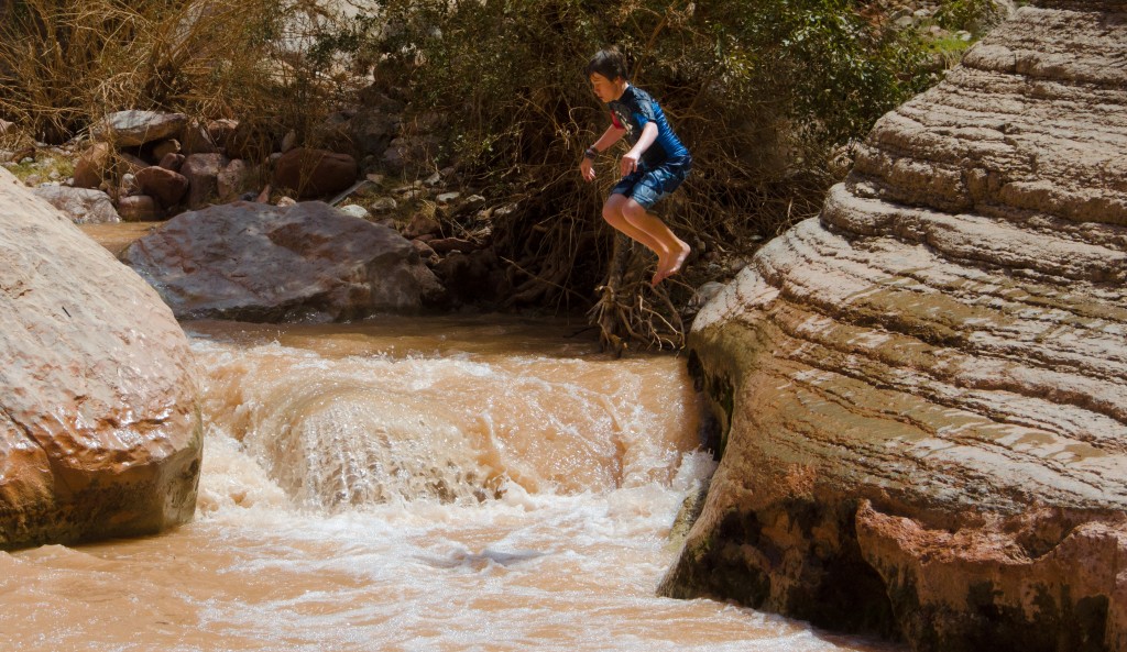 Kyle jumping into a side stream.