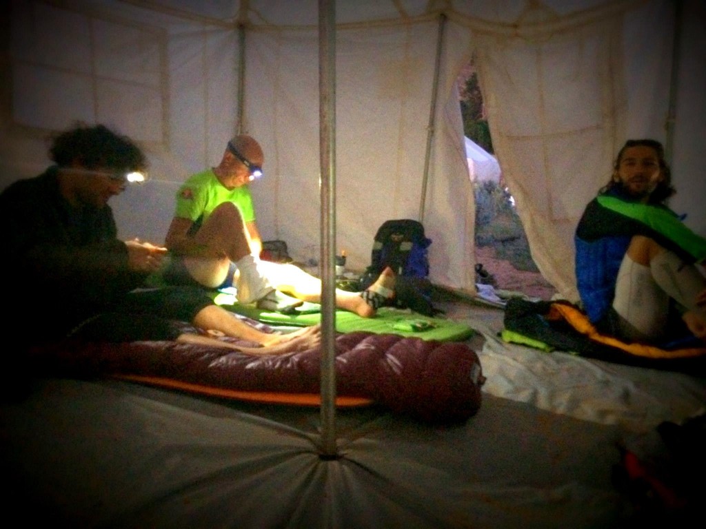 Dan, Danny and Mickey taking care of their feet and gear. Photo by Simon Dodd