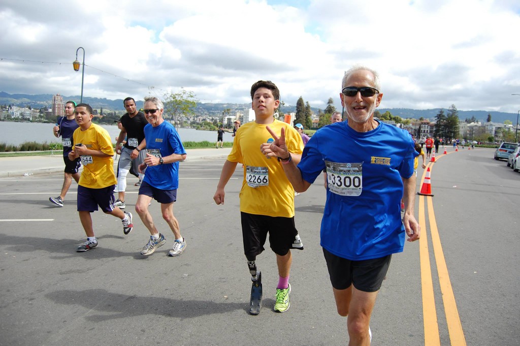 This, to me, captures the power of running and community. I got to know Howard Nathel, the volunteer in the blue shirt in front, a decade ago when we both volunteered for Students Run Oakland. He's still helping Oakland youth through Running for a Better Oakland. Imagine the courage of that young man behind him, and what it took to recover and run on that prosthetic limb. (Photo courtesy RBO's FB page.)